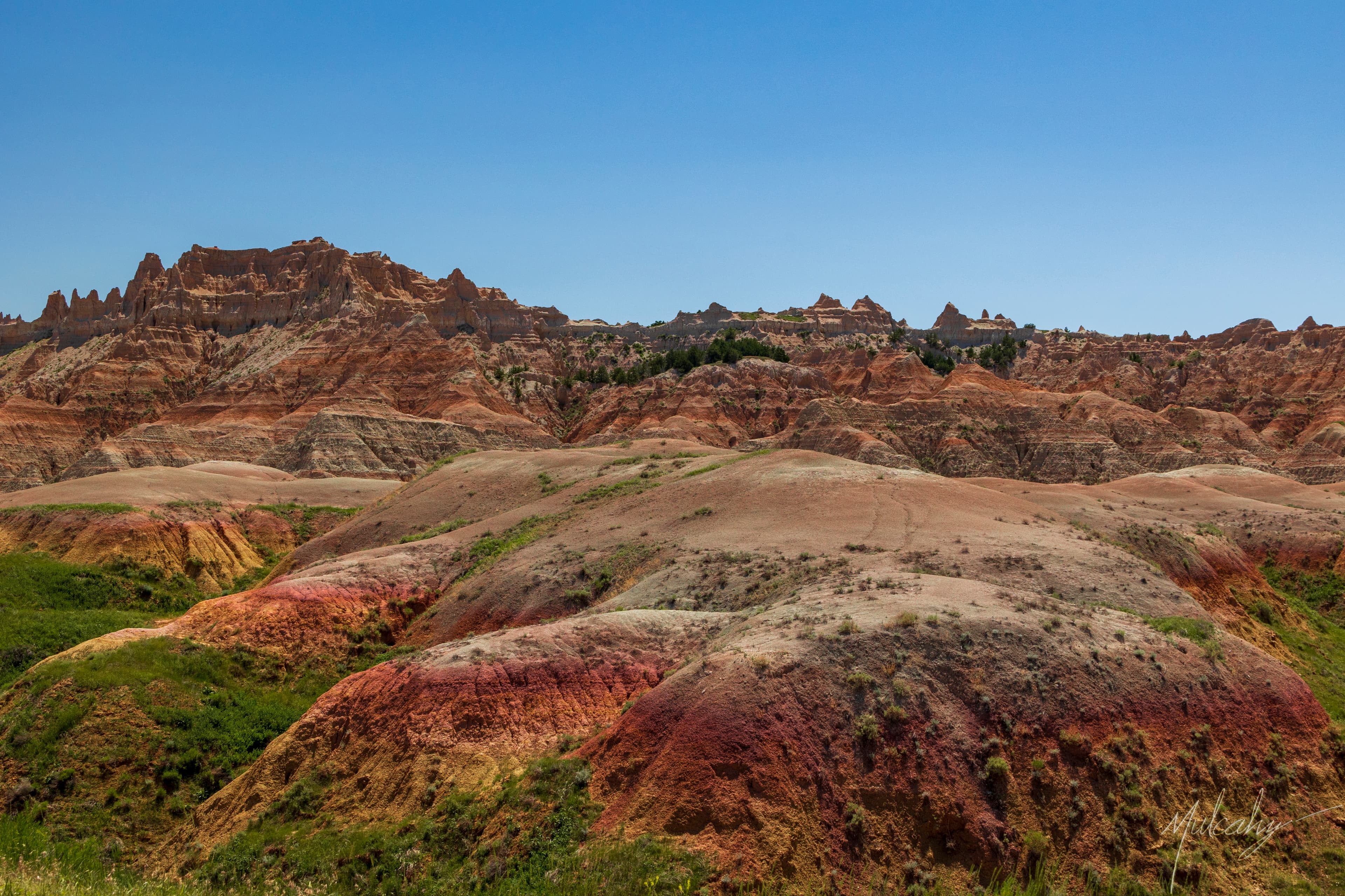 Colorful eroded red and brown formations in Badlands National Park